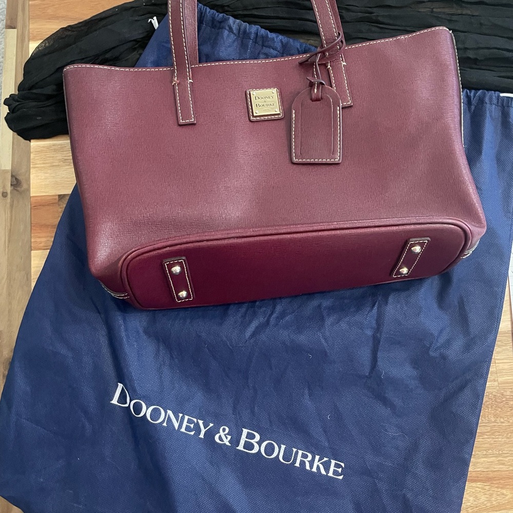 Dooney & Bourke Red Tote Bag with Structured Design and Metal Accents